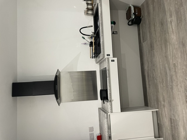 The accessible hob and sink area of Finlay's new kitchen, with open space beneath for wheelchair access